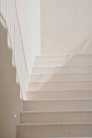 Pale stone staircase in soft natural light